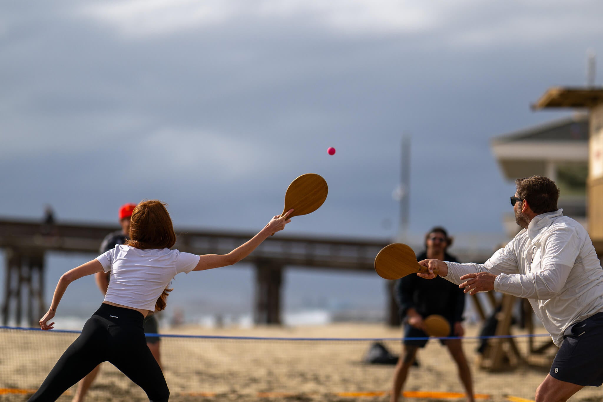 4 players playing doubles Rally On and Speed Rally