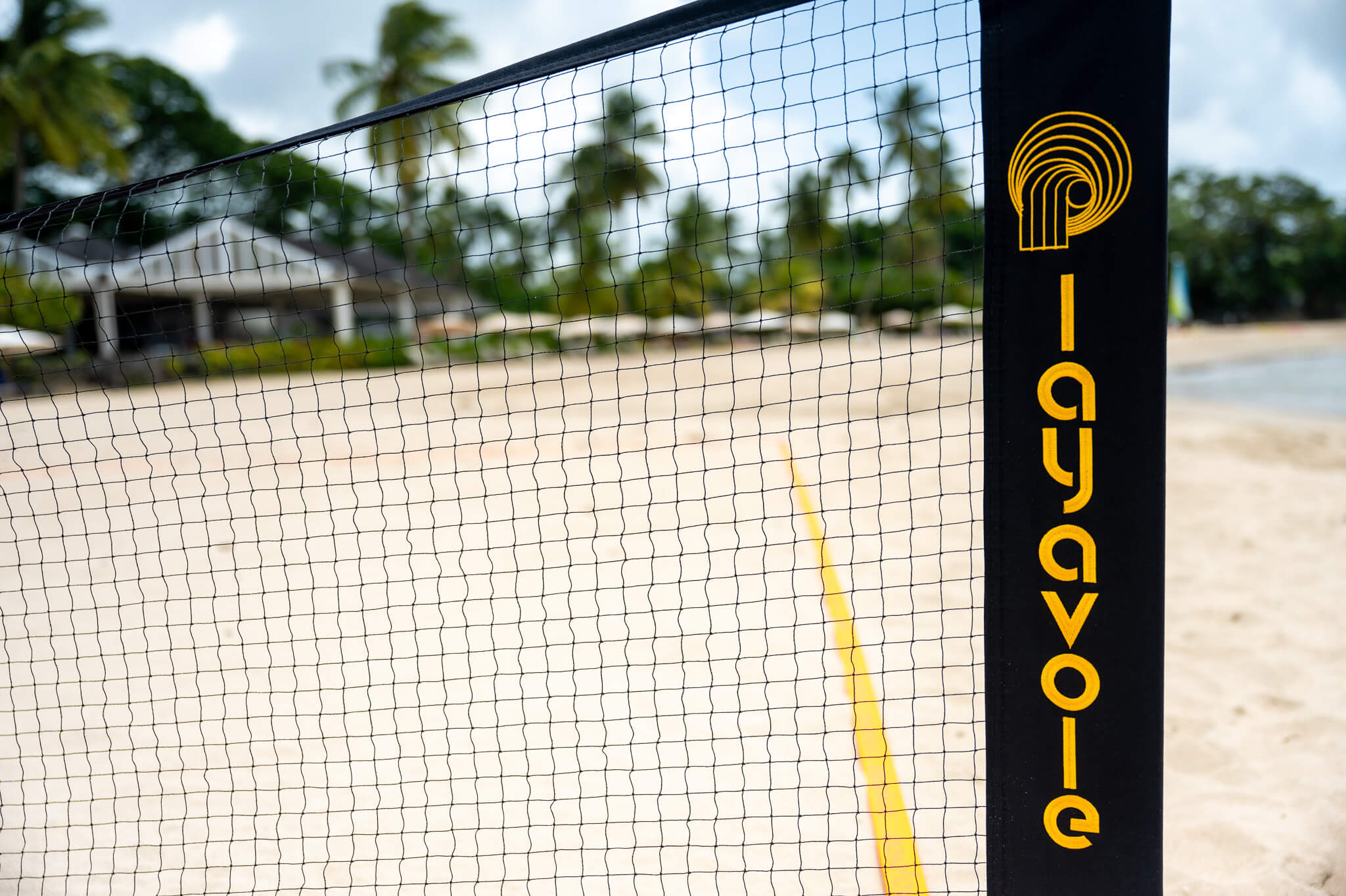 Close up of embroidery on Rally Court with resort in background